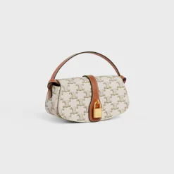 CLUTCH ON STRAP TABOU in Triomphe canvas and calfskin