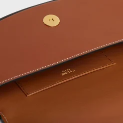 CLUTCH ON STRAP TABOU in Smooth calfskin