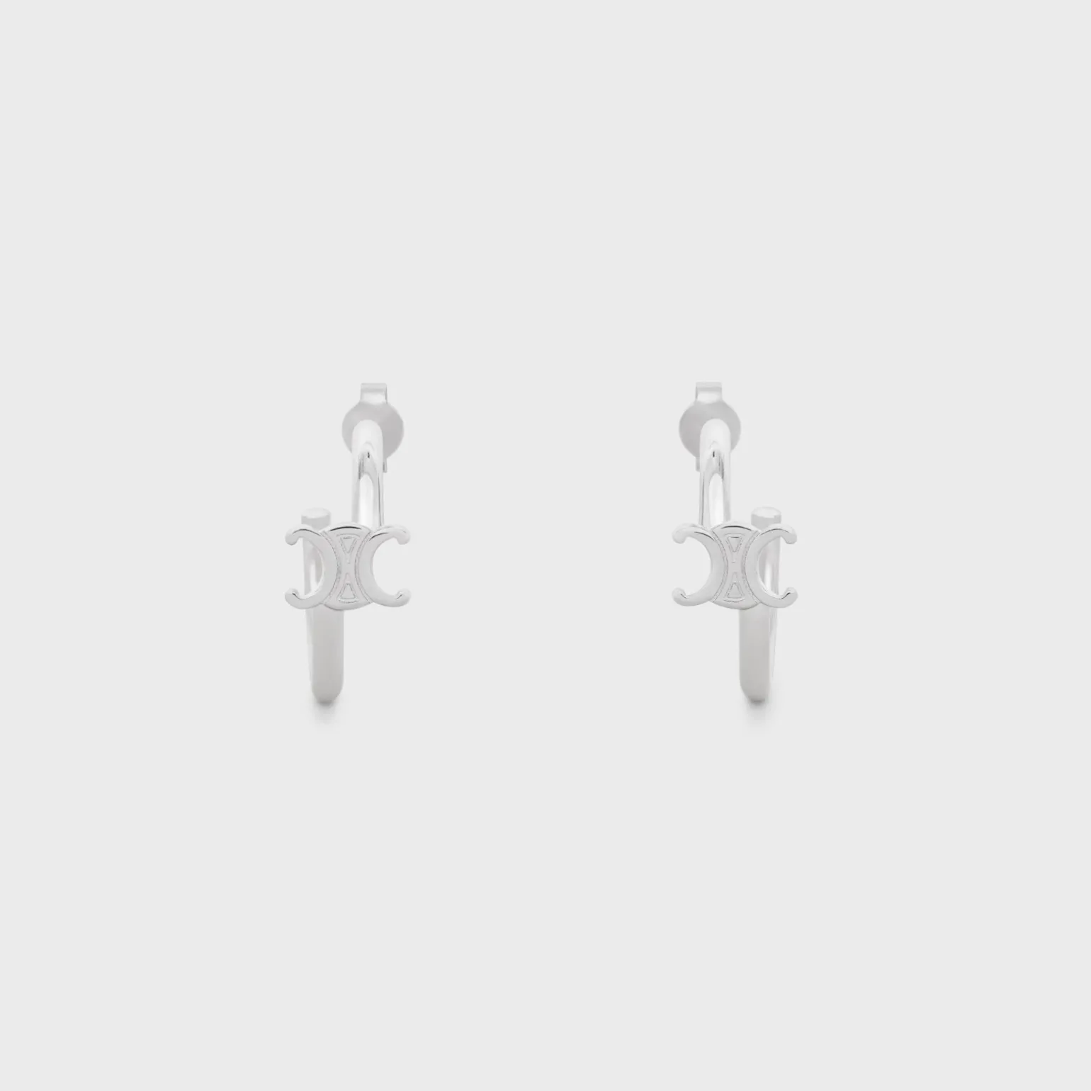 Triomphe Asymmetric Hoops in Brass with Rhodium Finish