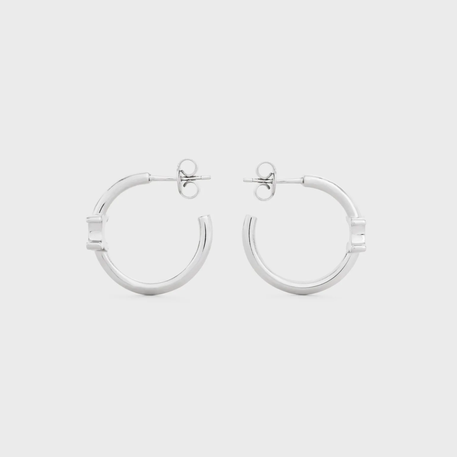 Triomphe Asymmetric Hoops in Brass with Rhodium Finish