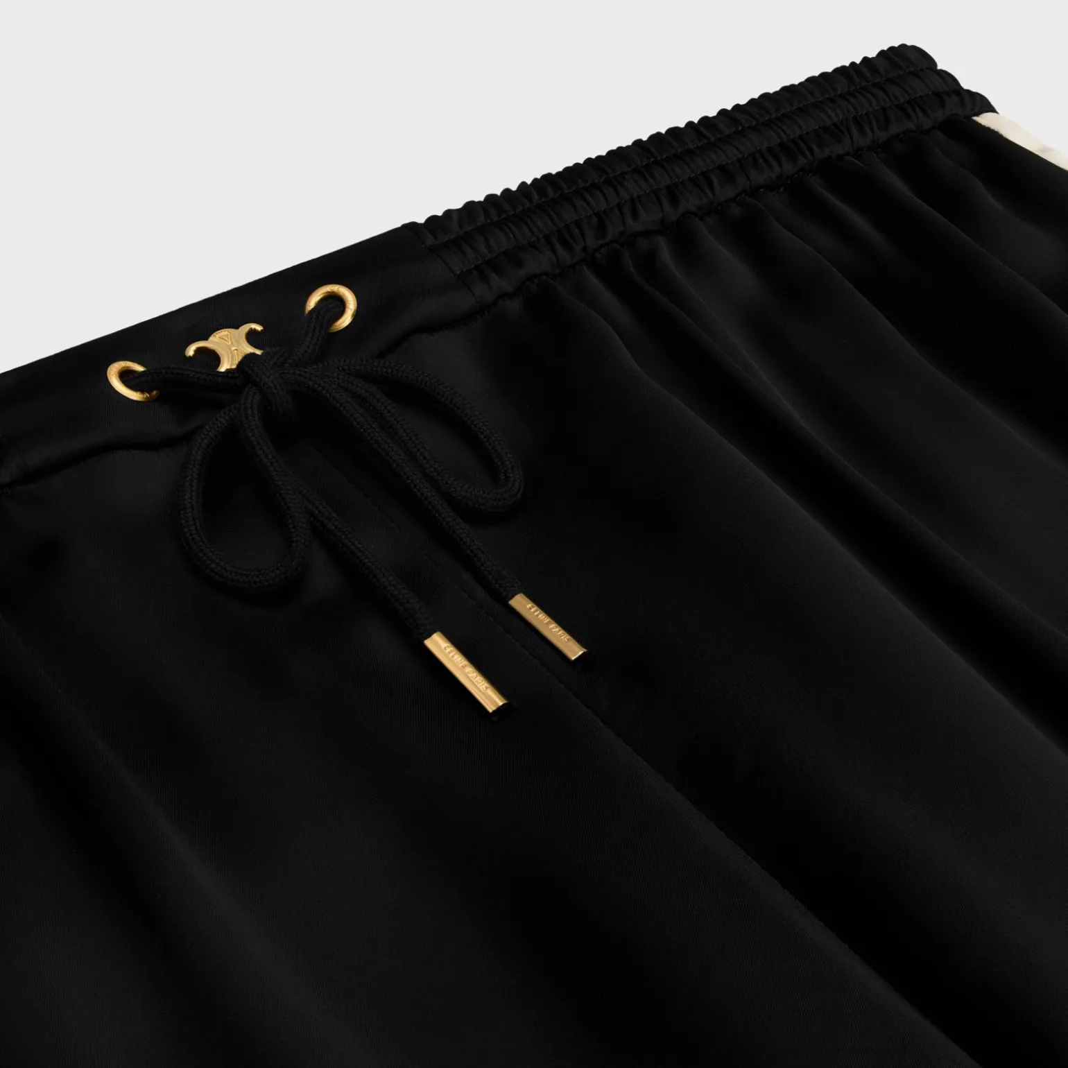triomphe jogging pants in flowing satin